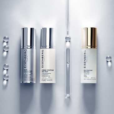 three targeted eye creams and a pipette aligned on a grey background with transparent bubbles